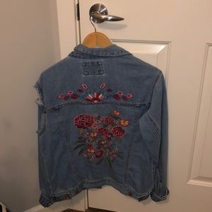 Embroidered and distressed denim jacket
